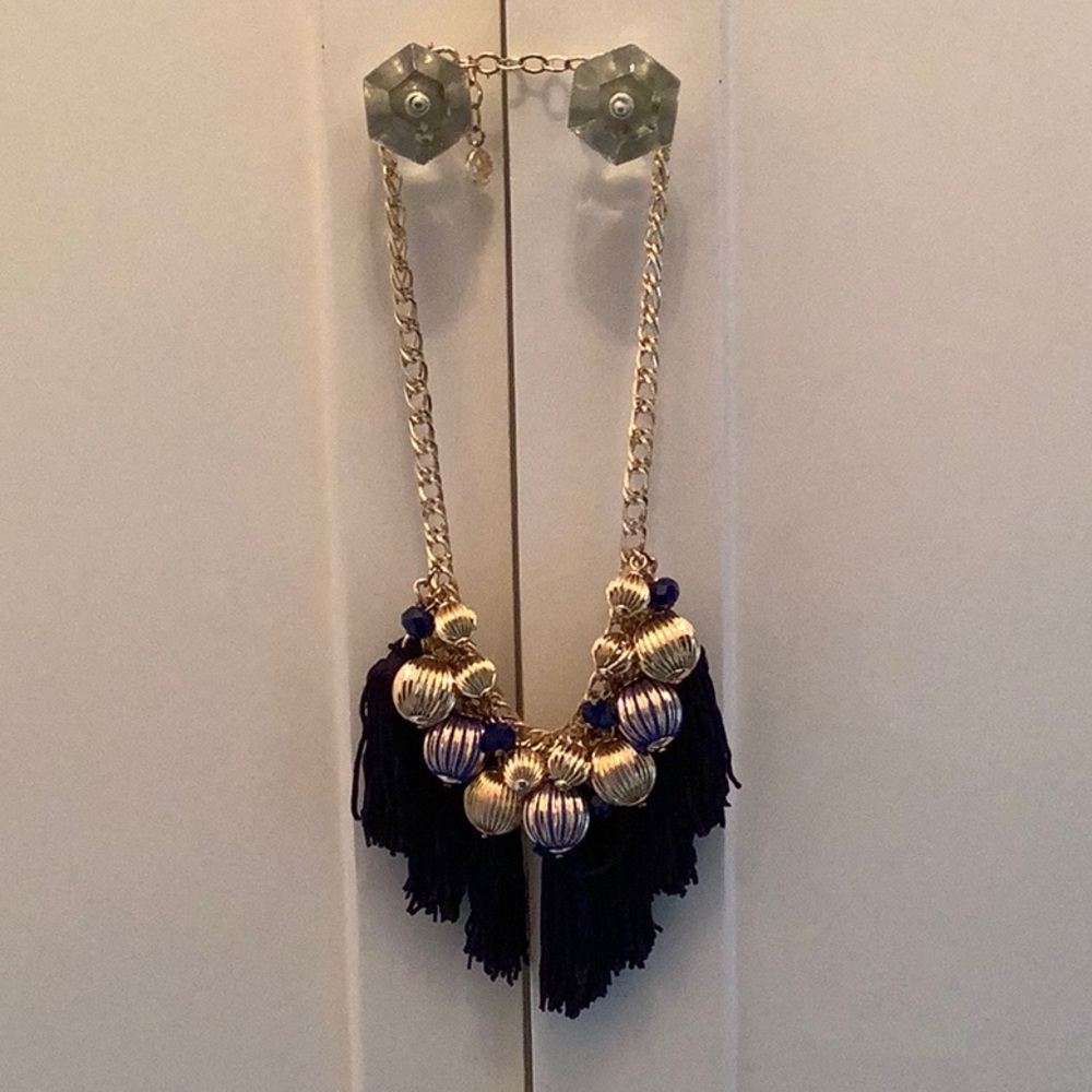 Beautiful gold Lilly necklace with navy tassels